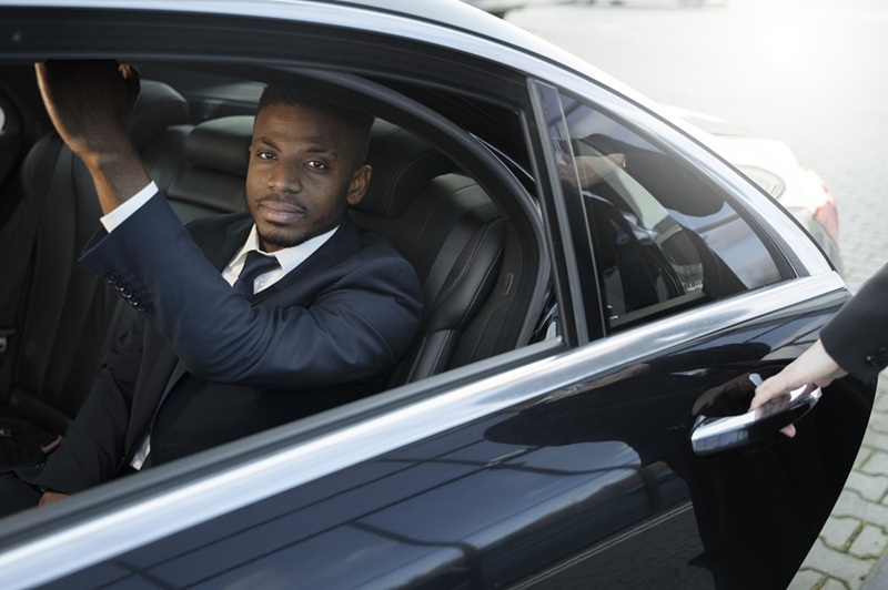 elegant uber driver giving taxi ride